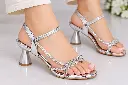 Silver Rhinestone Sandals on Display.webp